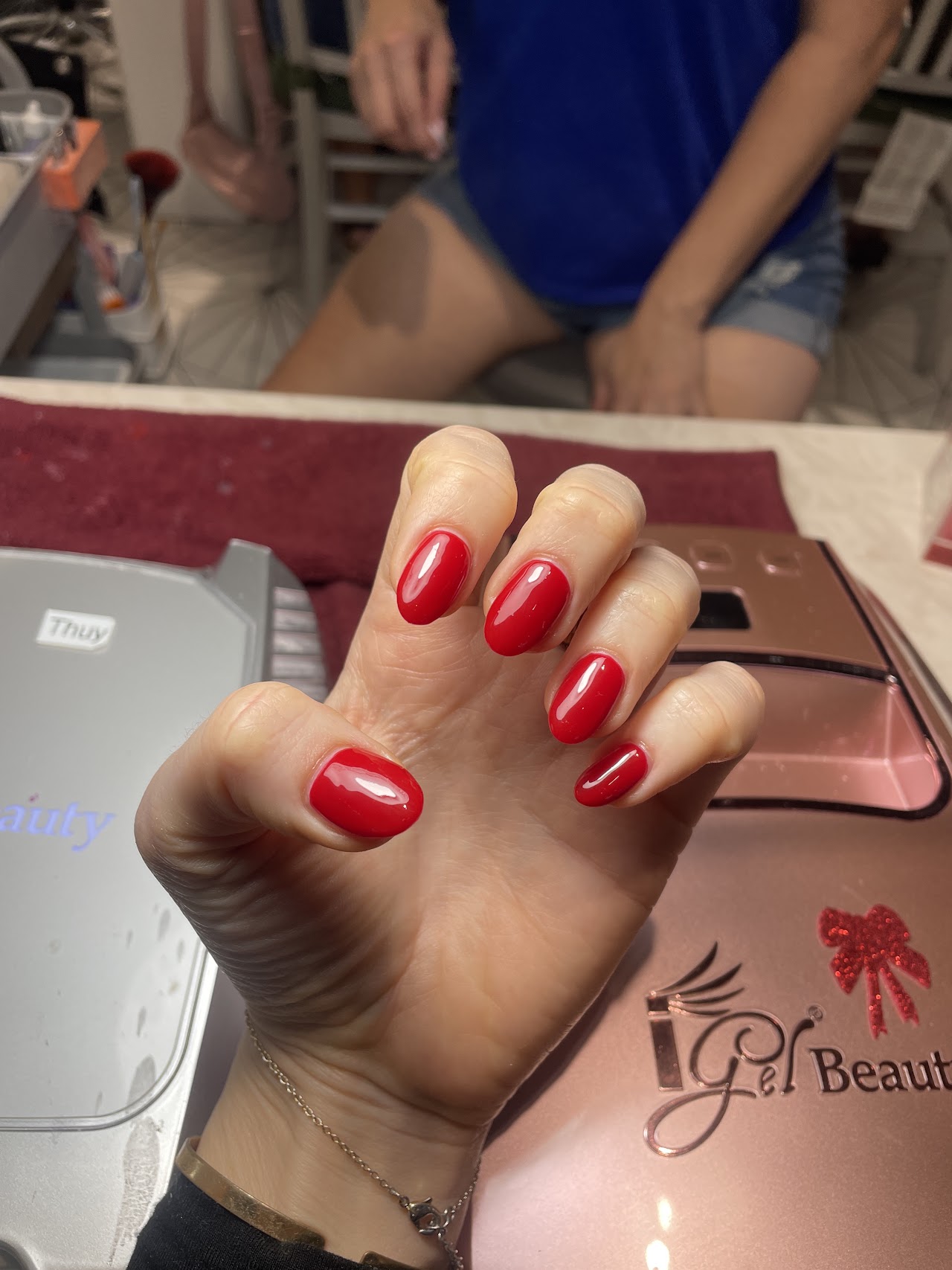 Freshly done red gel manicure at Heavenly Nails & Spa, Tampa