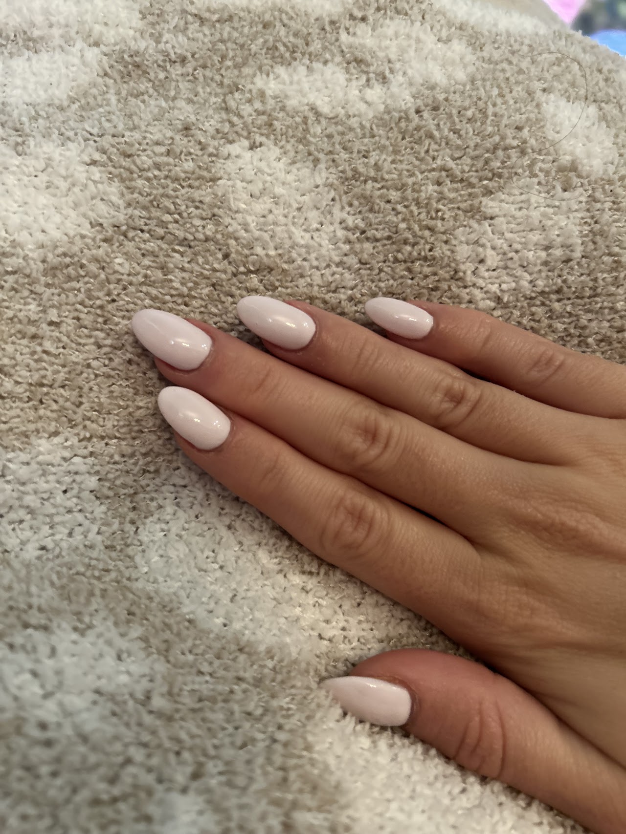 Soft pink almond-shaped manicure by Heavenly Nails & Spa