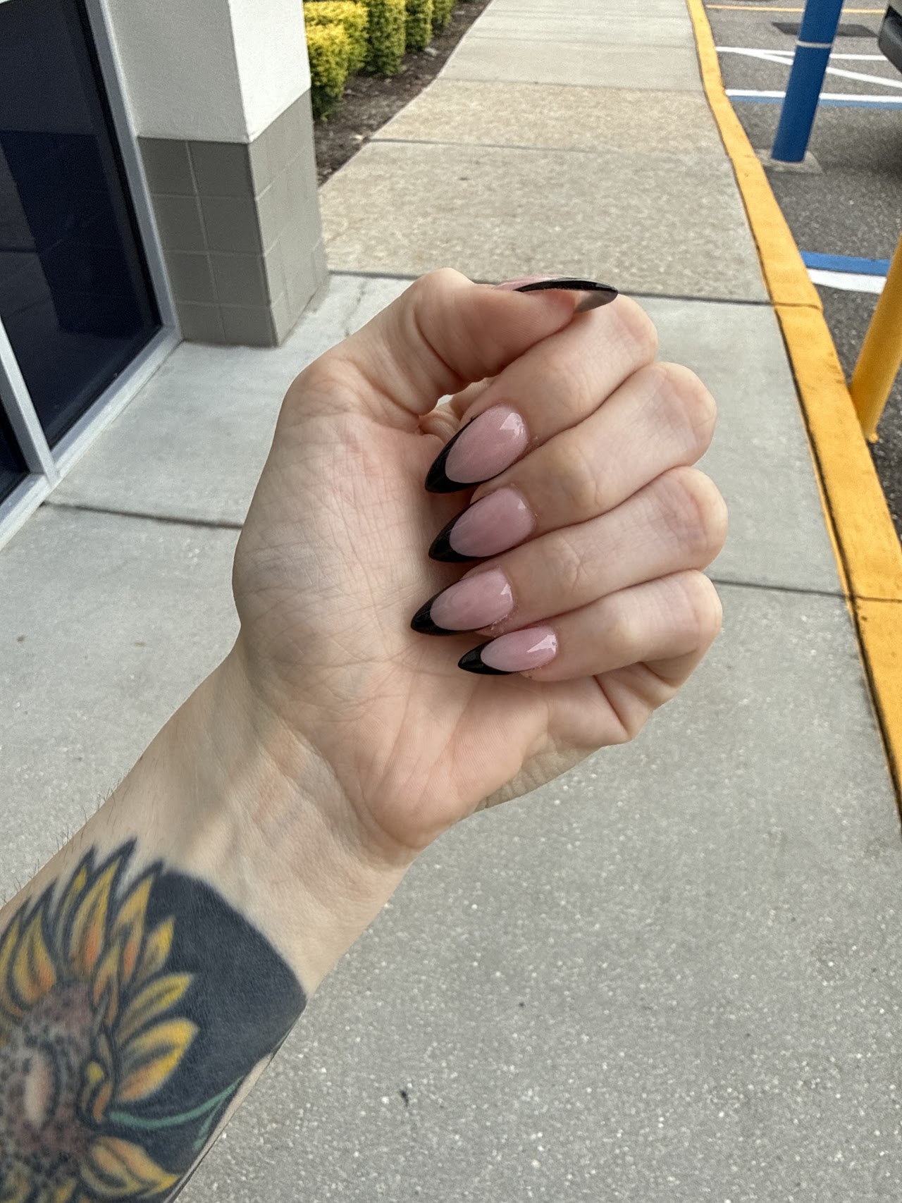 Black French tip nail art by Heavenly Nails & Spa